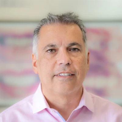 A headshot photo of dentist Kamran Rafie from Granada Hills Dental Group